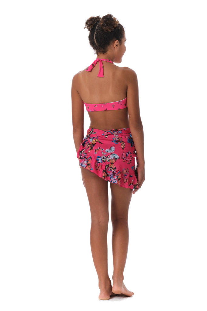 Girl is wearing Submarine designer swimwear Fly Away Pink print sarong.